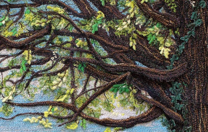 Expanded detail of a thread painting, showing stitched branches and leaves